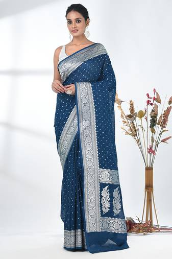 teal georgette saree with silver border and detailing