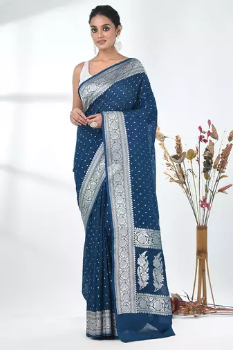 teal georgette saree with silver border and detailing