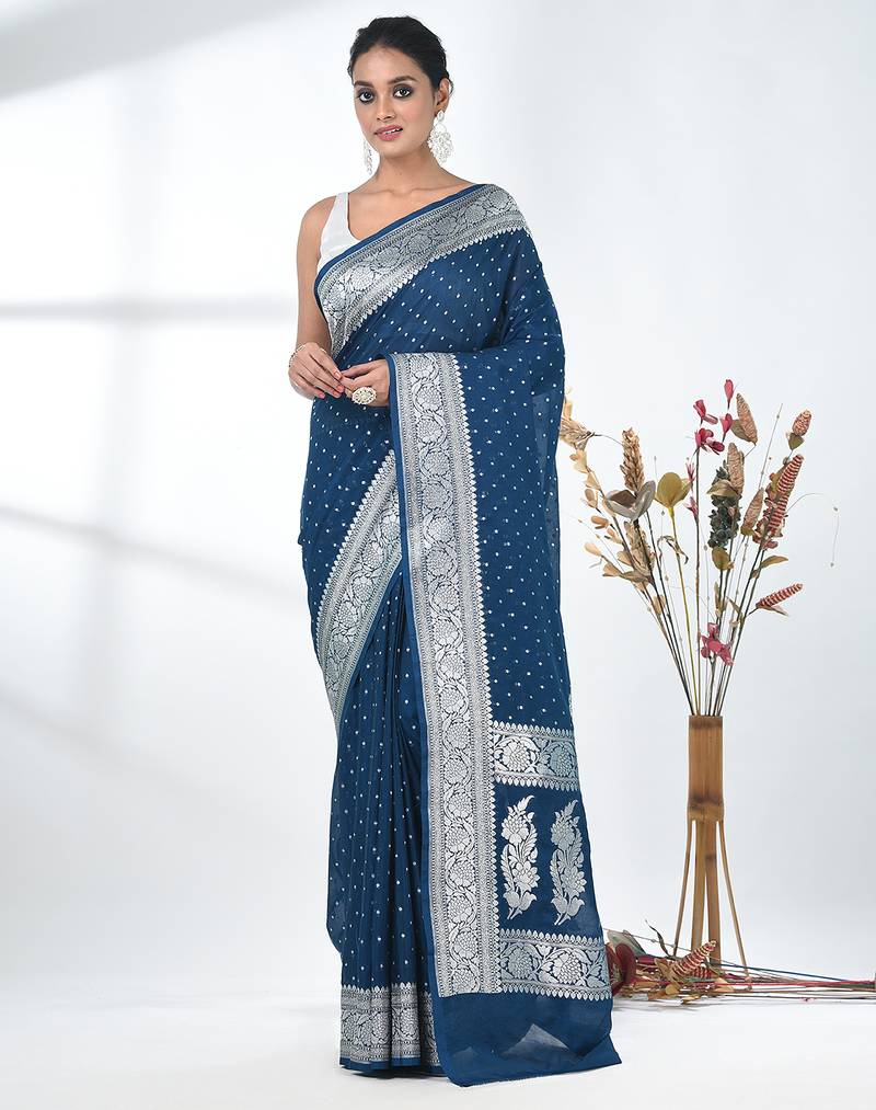 teal georgette saree with silver border and detailing