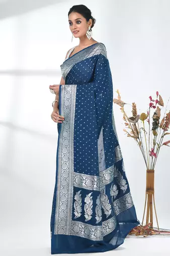 teal georgette saree with silver border and detailing