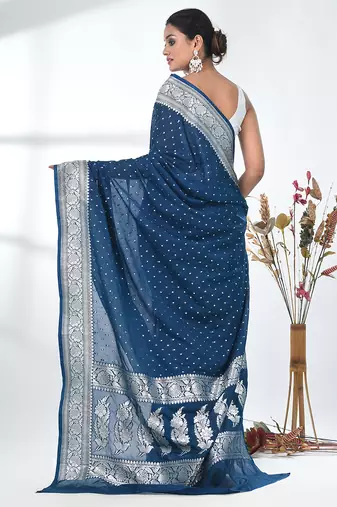 teal georgette saree with silver border and detailing