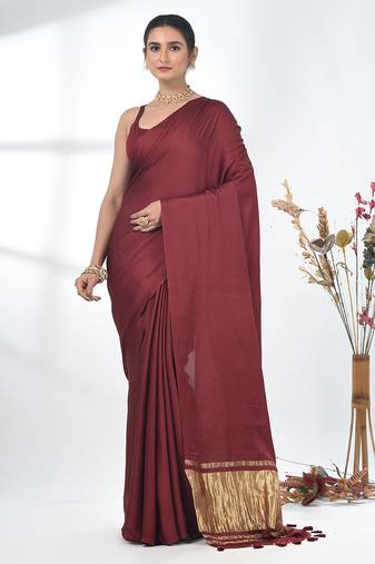 maroon modal silk blend saree with golden border and tassels