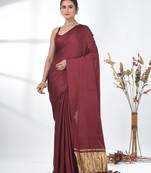 maroon modal silk blend saree with golden border and tassels