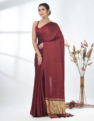 maroon modal silk blend saree with golden border and tassels 2
