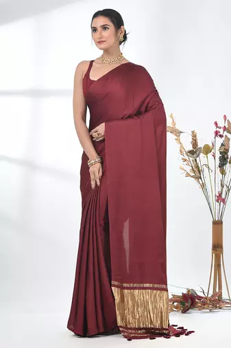 maroon modal silk blend saree with golden border and tassels