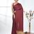 maroon modal silk blend saree with golden border and tassels