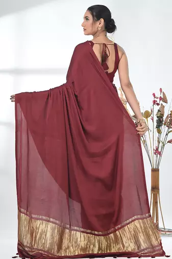 maroon modal silk blend saree with golden border and tassels