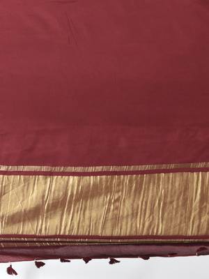 maroon modal silk blend saree with golden border and tassels 4