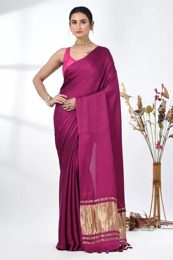 magenta modal silk blend saree with golden border and tassels