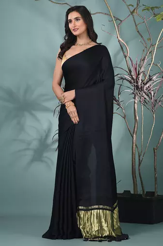 black modal silk blend saree with golden border and tassels