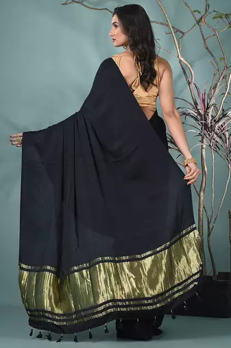 black modal silk blend saree with golden border and tassels