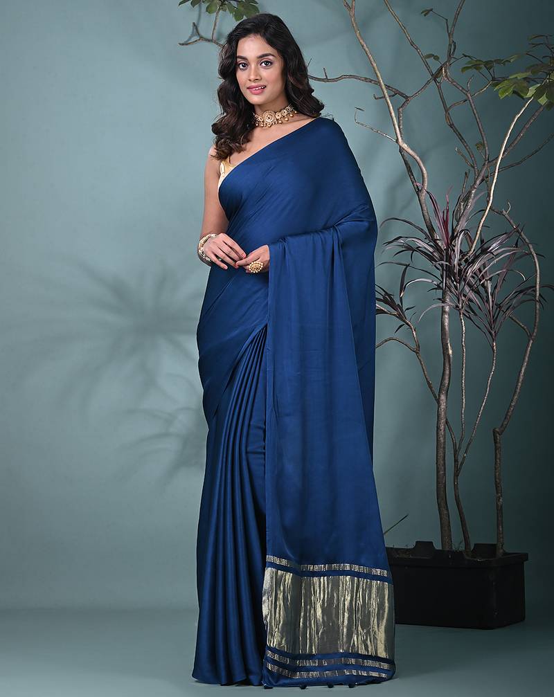 cobalt blue modal silk blend saree with golden border and tassels