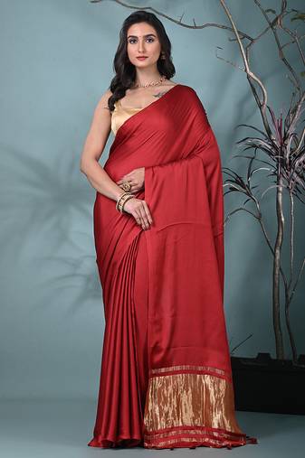 red modal silk blend saree with golden border and tassels