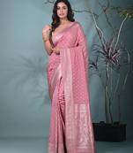 elegant nude pink georgette saree with intricate silver zari work