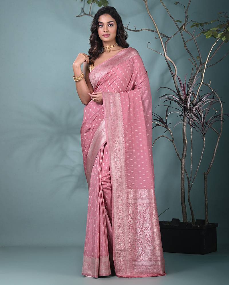 elegant nude pink georgette saree with intricate silver zari work