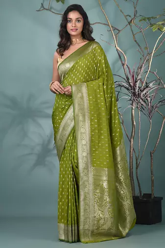elegant green georgette saree with intricate silver zari work
