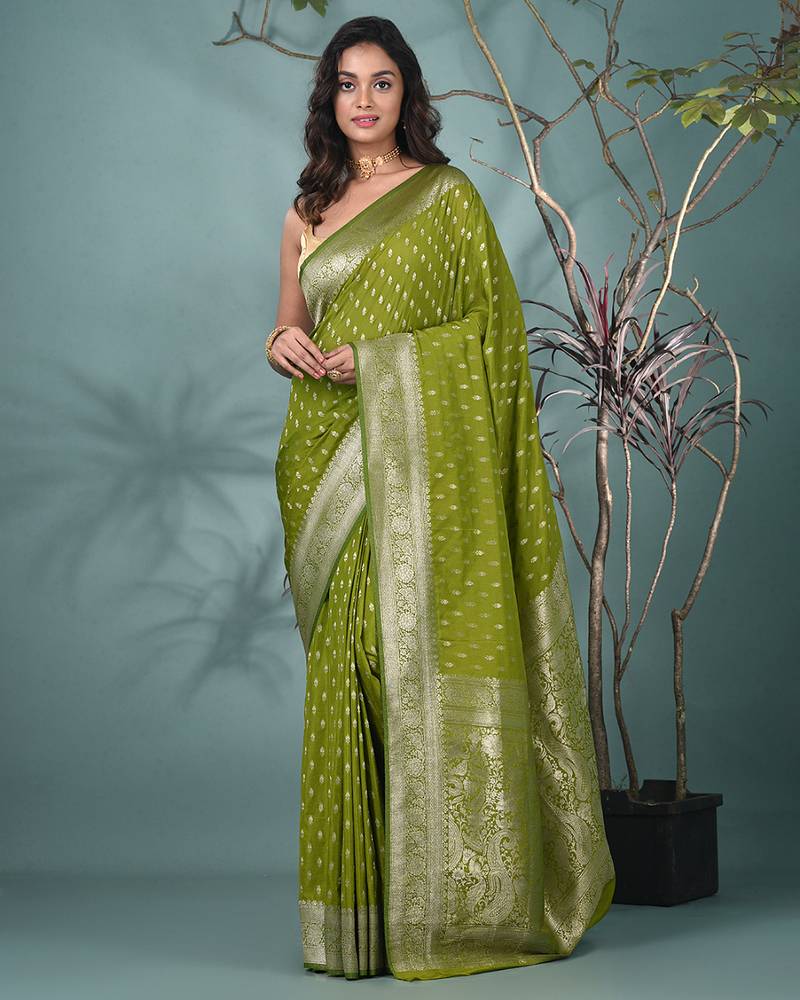 elegant green georgette saree with intricate silver zari work