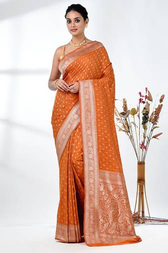 elegant orange georgette saree with intricate silver zari work