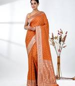 elegant orange georgette saree with intricate silver zari work