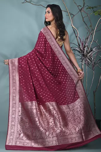 elegant fuchsia georgette saree with intricate silver zari work