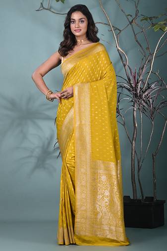elegant yellow georgette saree with intricate silver zari work