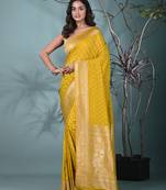 elegant yellow georgette saree with intricate silver zari work