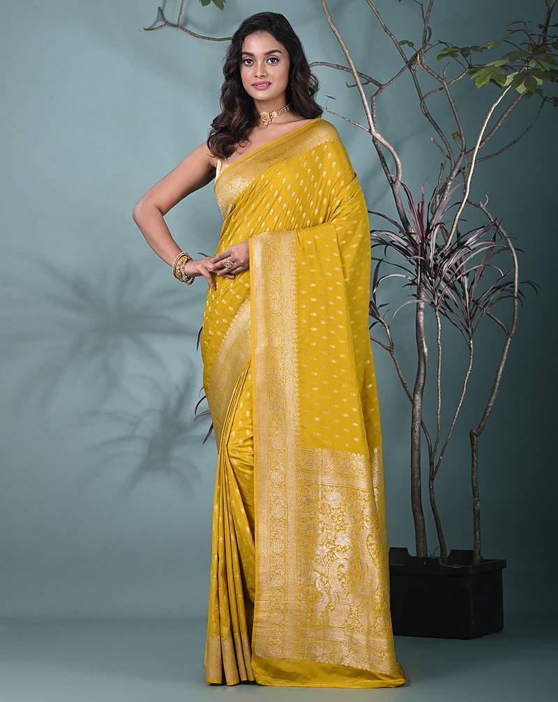 elegant yellow georgette saree with intricate silver zari work