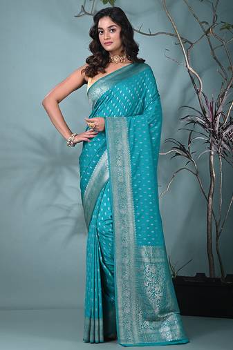 elegant turquoise blue georgette saree with intricate silver zari work