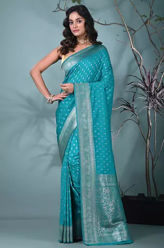 elegant turquoise blue georgette saree with intricate silver zari work
