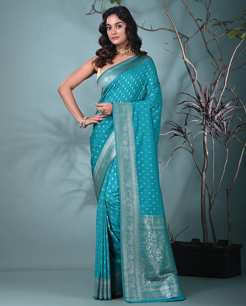 elegant turquoise blue georgette saree with intricate silver zari work