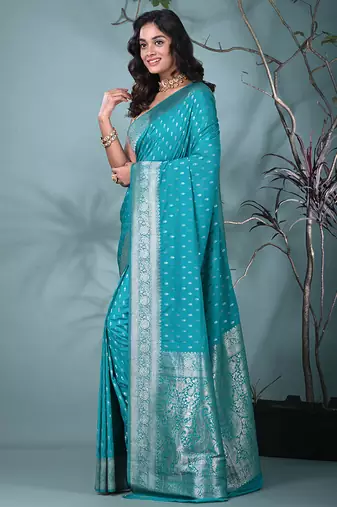 elegant turquoise blue georgette saree with intricate silver zari work