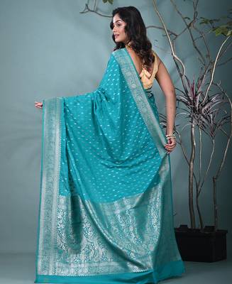 elegant turquoise blue georgette saree with intricate silver zari work 3
