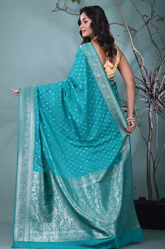 elegant turquoise blue georgette saree with intricate silver zari work
