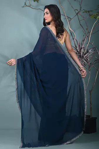stylish teal chiffon saree with stone work border