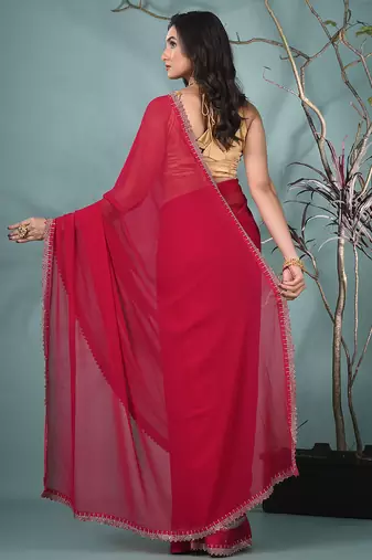 stylish fuchsia chiffon saree with stone work border