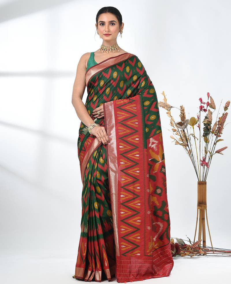 exquisite green pochampally silk blend saree with vibrant ikat pattern