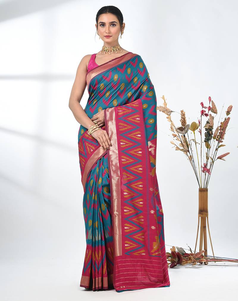 exquisite teal pochampally silk blend saree with vibrant ikat pattern