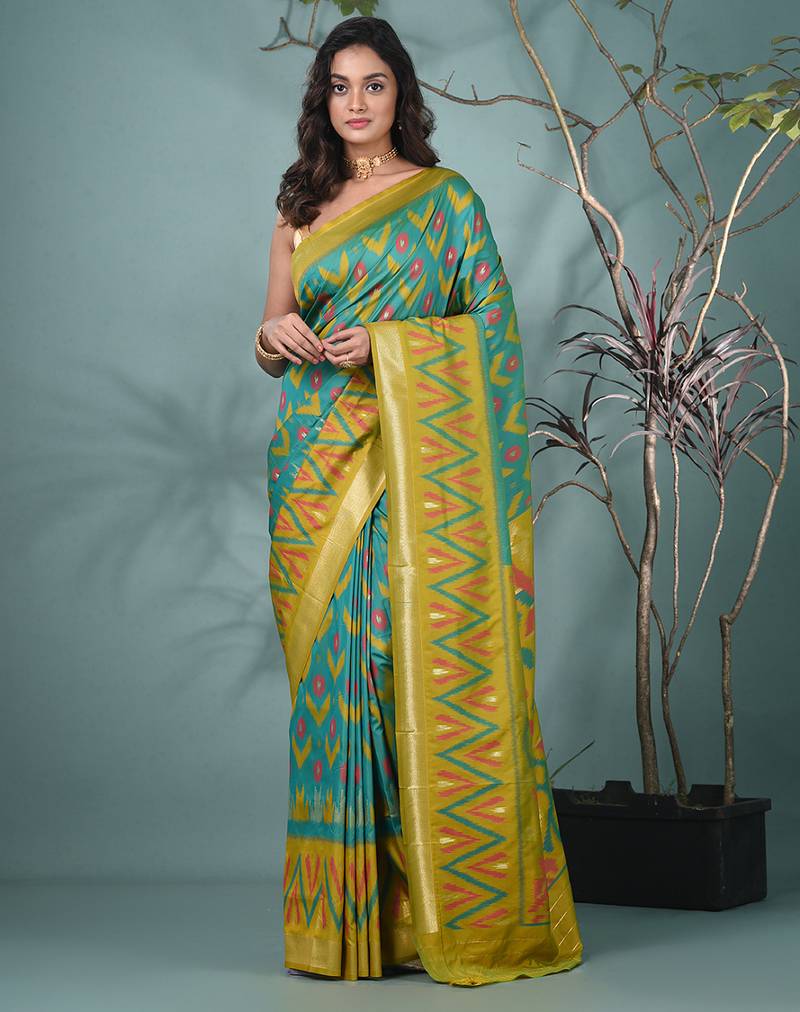 exquisite turquoise blue pochampally silk blend saree with vibrant ikat pattern
