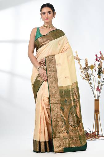 glamorous beige south silk blend saree with intricate zari border