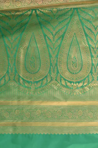 glamorous brown south silk blend saree with intricate zari border
