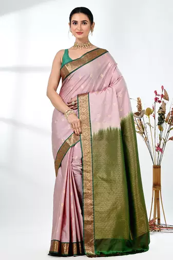 elegant pale pink south silk blend saree with green zari border