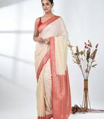 elegant off-white tussar silk blend saree with red zari border