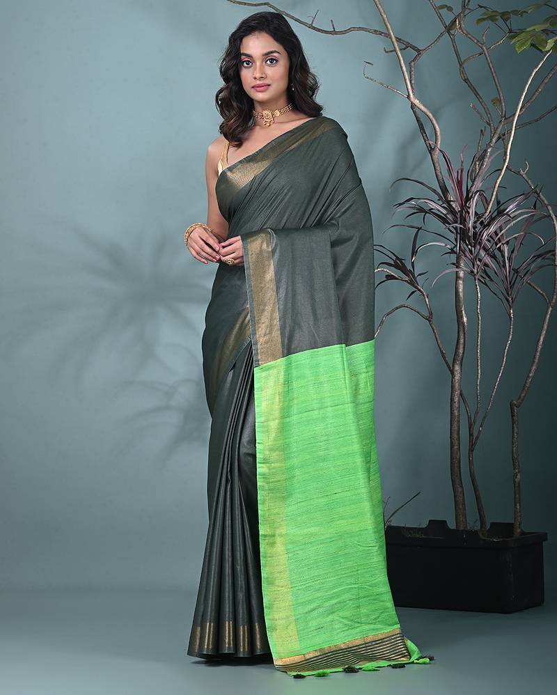 emerald green viscose saree with gheecha pallu and golden border