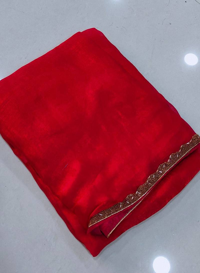 Red color fendy chiffon saree with running blouse