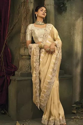Beige silk blend saree with embroidered zari work