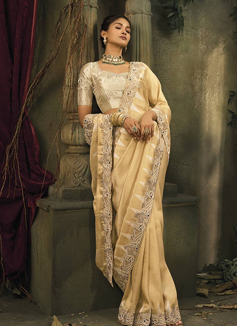 Beige silk blend saree with embroidered jari and cut-dana work