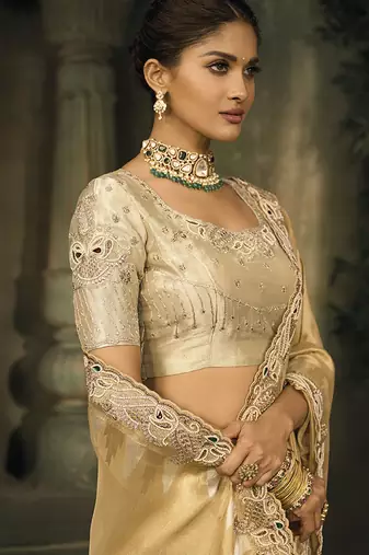 Beige silk blend saree with embroidered zari work