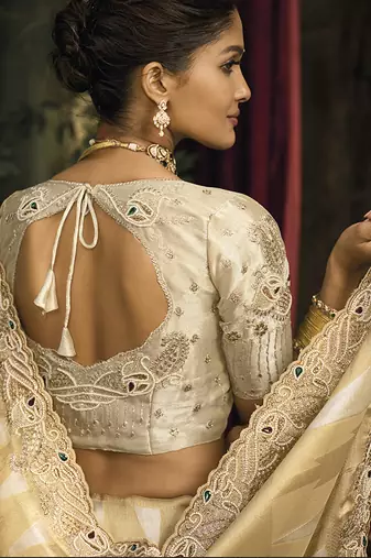 Beige silk blend saree with embroidered zari work
