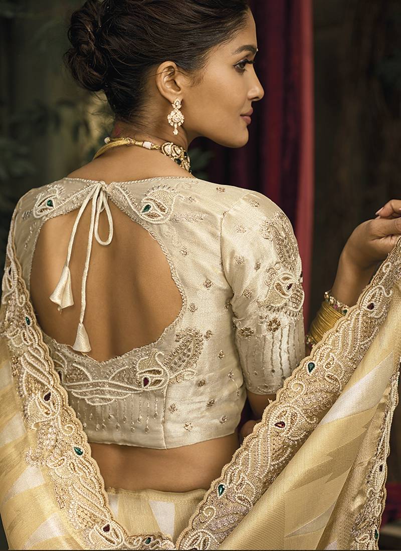 Beige silk blend saree with embroidered jari and cut-dana work