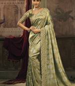 Olive green silk blend saree with embroidered jari and cut-dana work